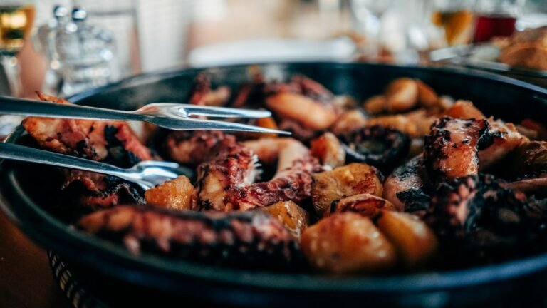 Prepared octopus dish served in a black bowl, illustrative seafood photograph