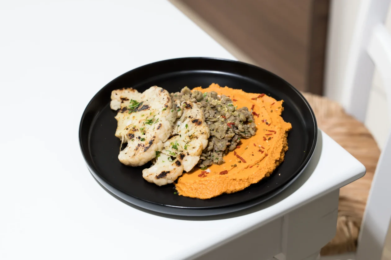 Roasted cauliflower with lentils and red hummus at Sensi Food in Limassol